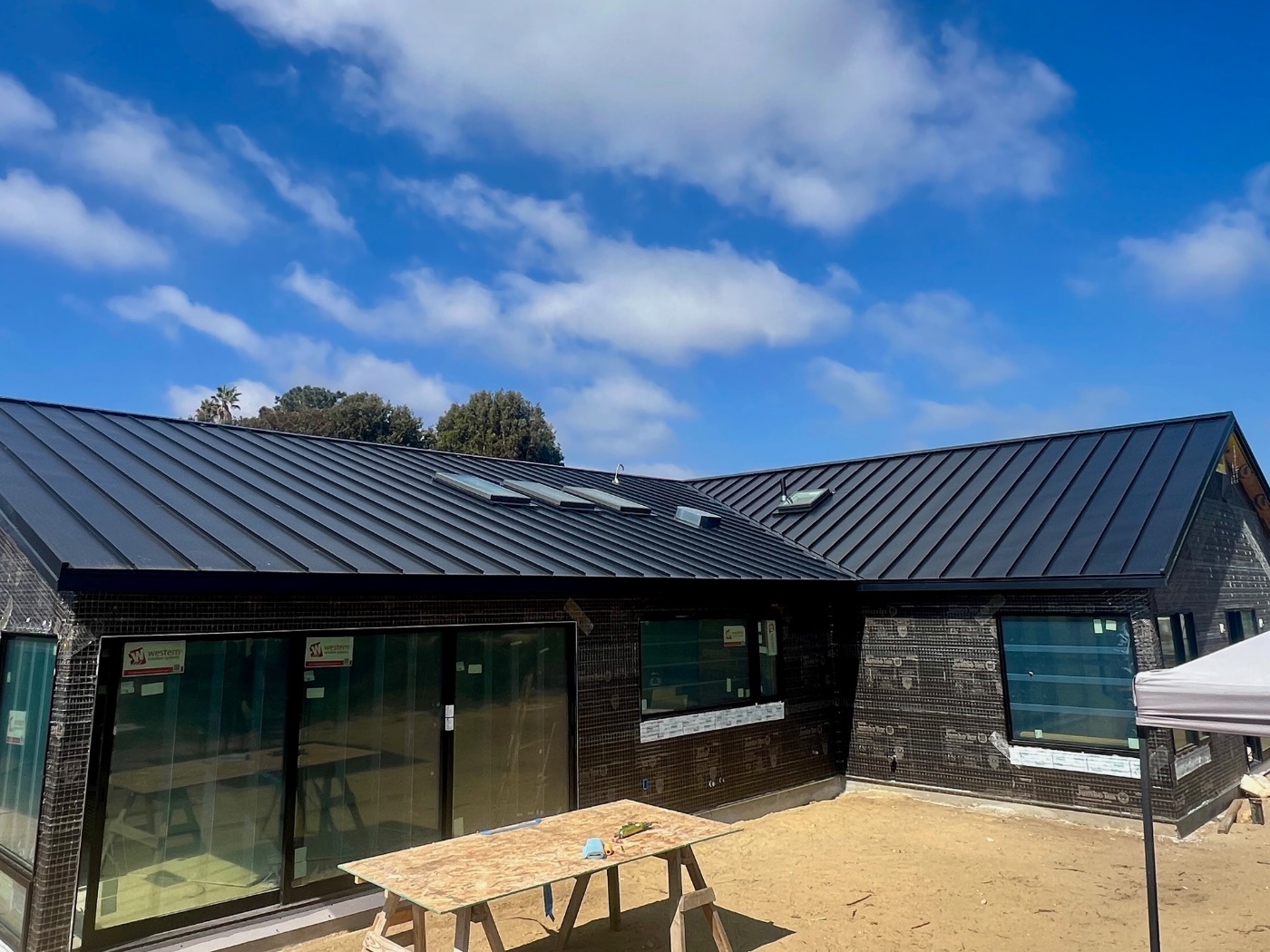 Rear elevation with dark standing seam metal roof